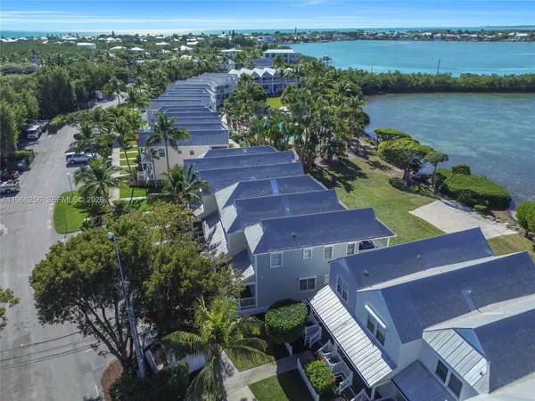 an aerial view of a city with lake view