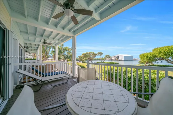 a view of a balcony with wooden floor
