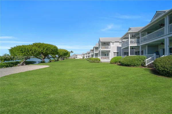 a view of a house with a big yard