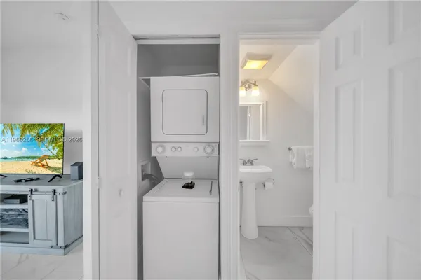 a view of hallway with washer and dryer