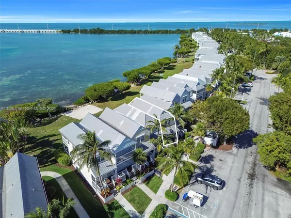 an aerial view of a house with outdoor space