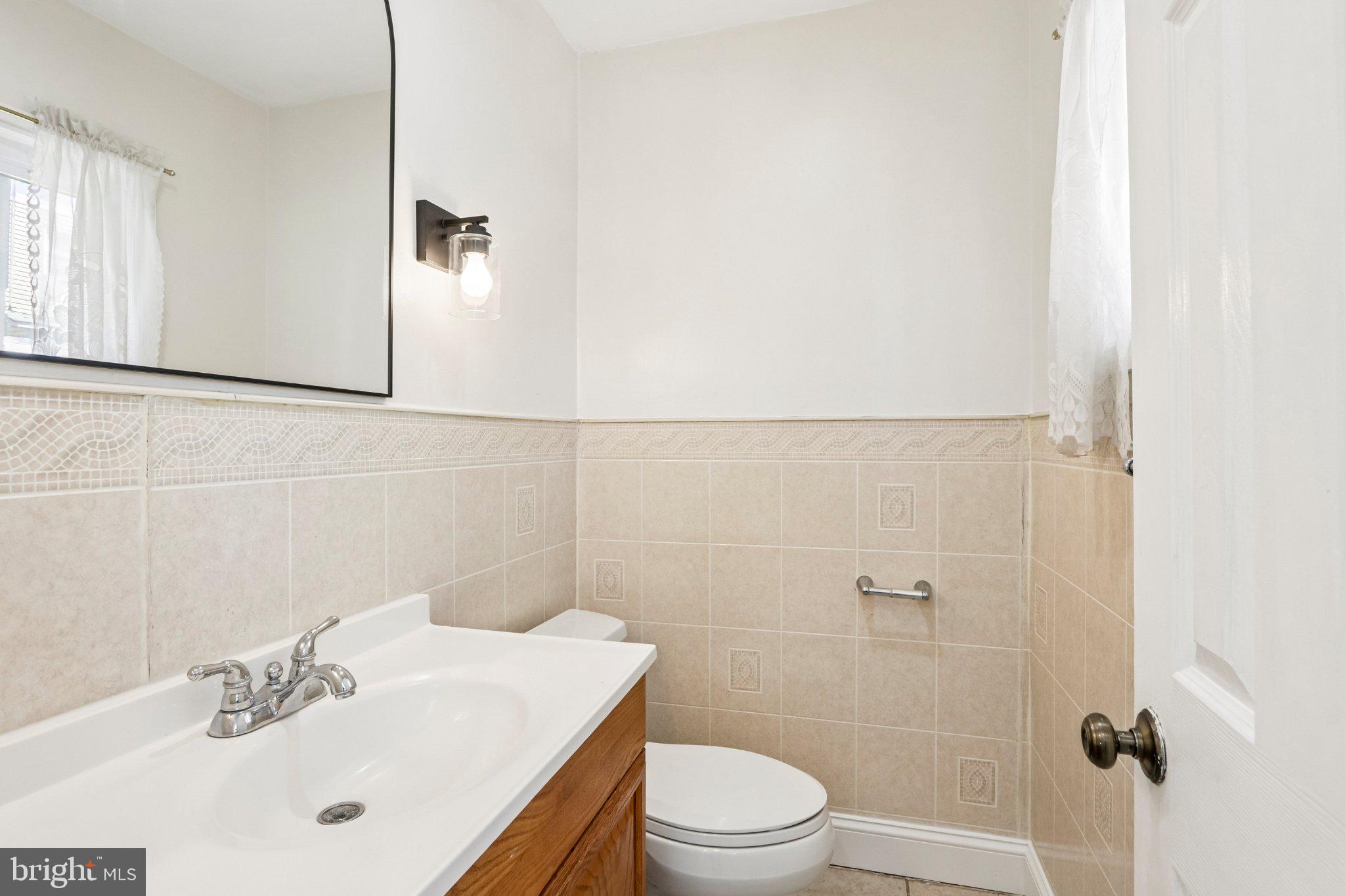 7407 Rogers Avenue Upper Darby, PA 19082 - Photo 20 of 50 a bathroom with a sink toilet and shower