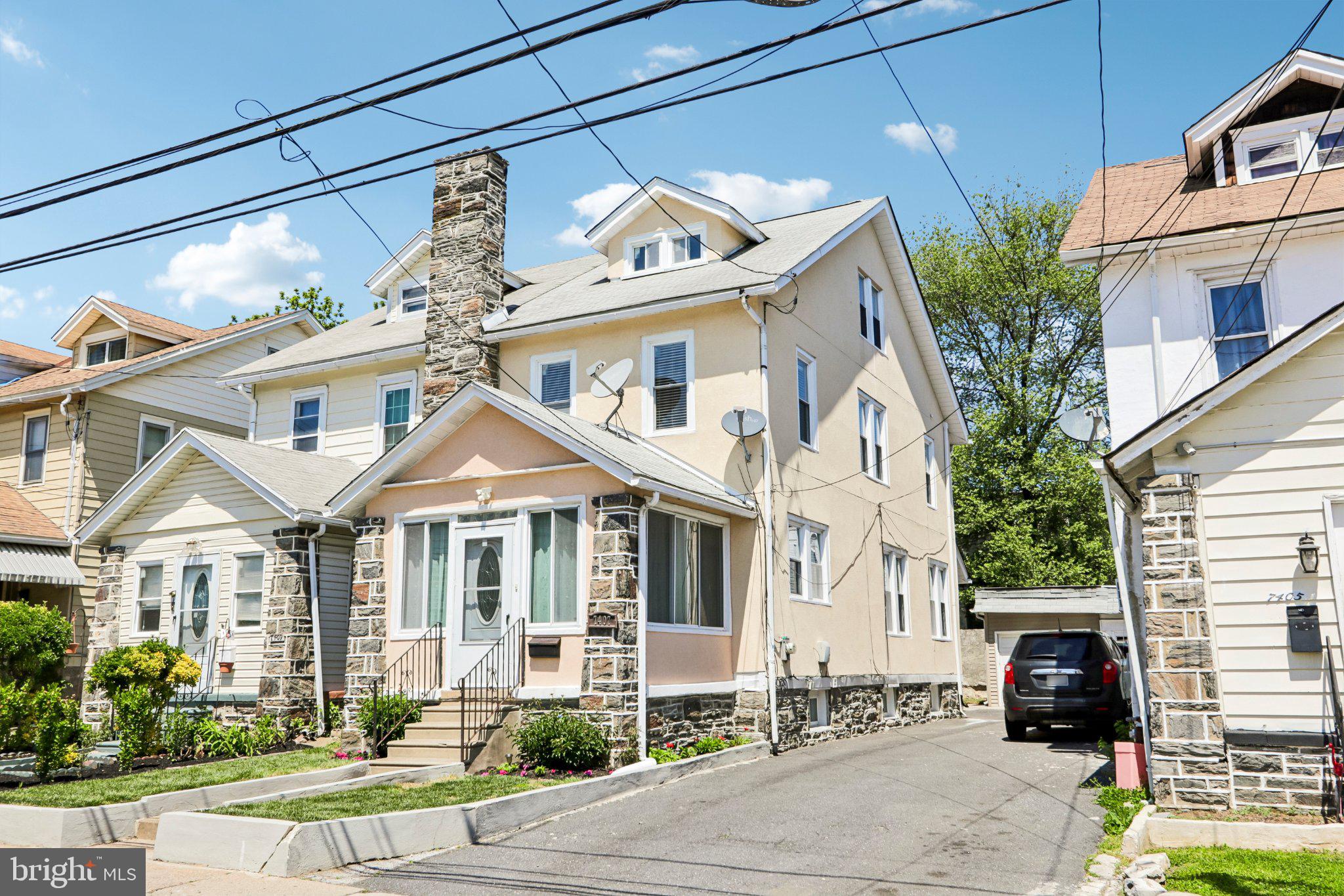 7407 Rogers Avenue Upper Darby, PA 19082 - Photo 2 of 50 a front view of a house with a garden