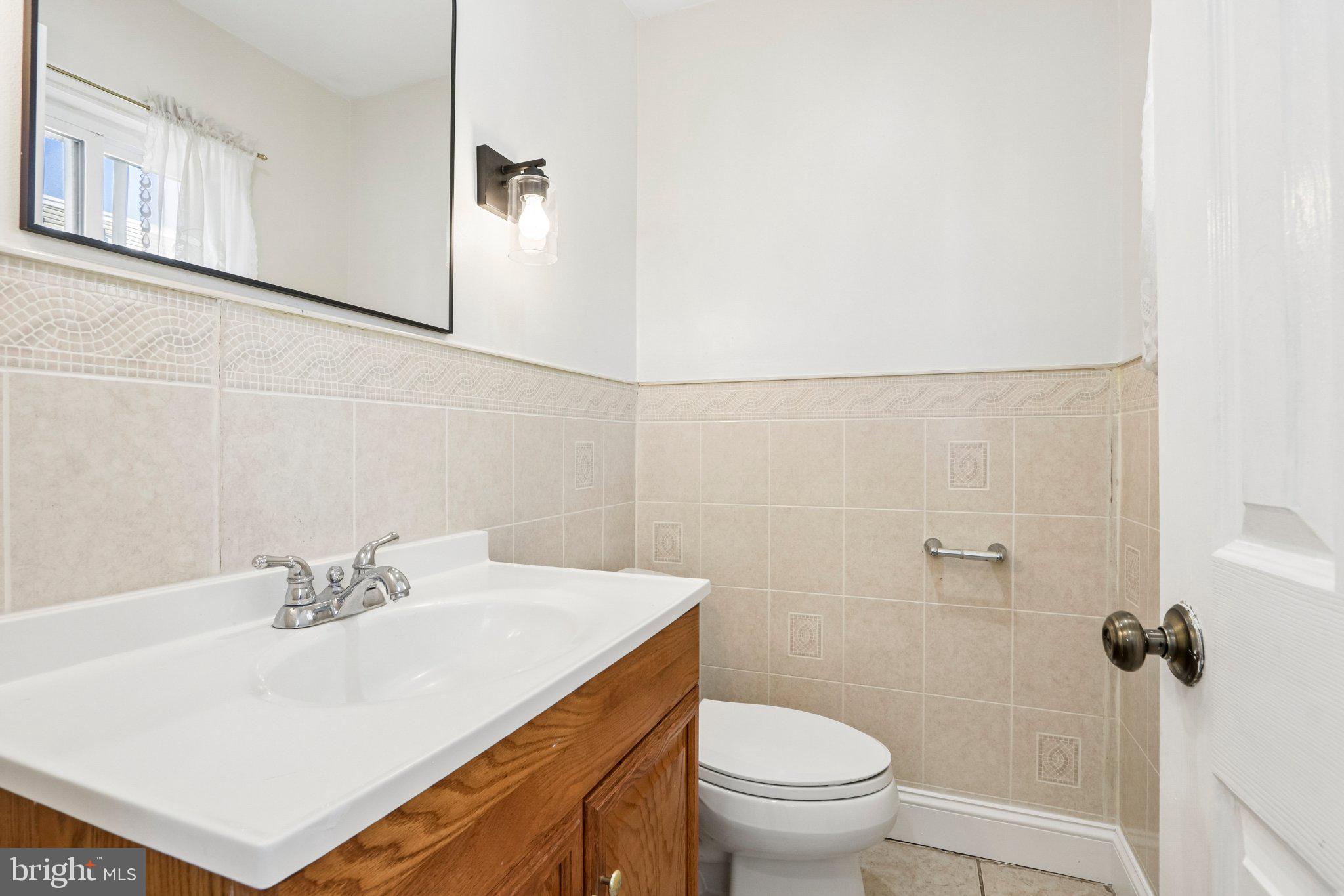 7407 Rogers Avenue Upper Darby, PA 19082 - Photo 21 of 50 a bathroom with a sink a toilet and shower