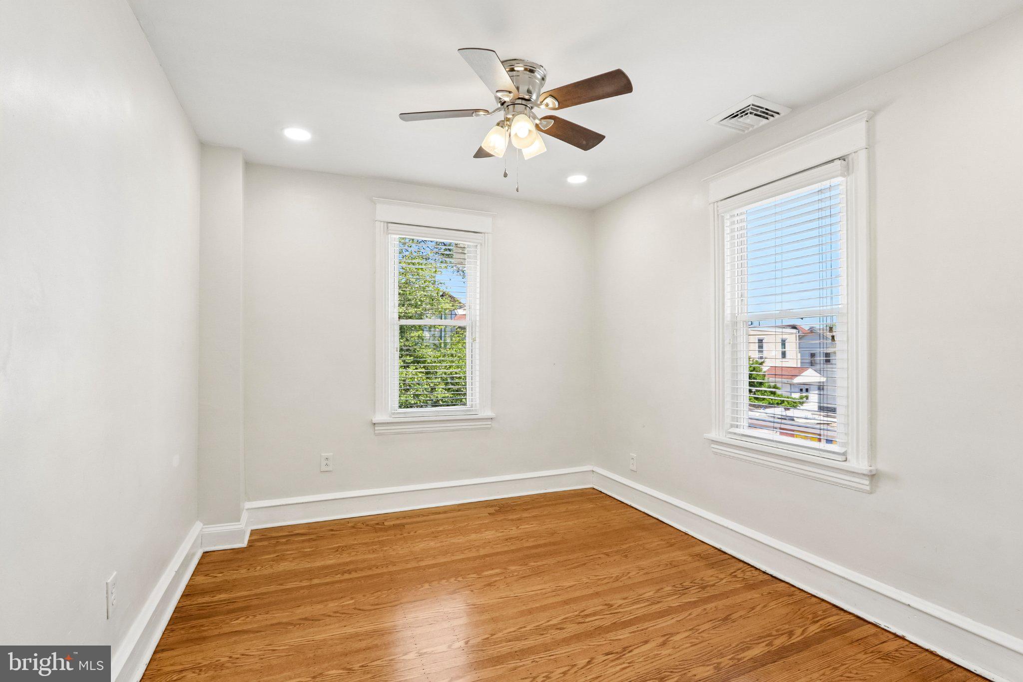 7407 Rogers Avenue Upper Darby, PA 19082 - Photo 24 of 50 a view of an empty room with wooden floor and a window