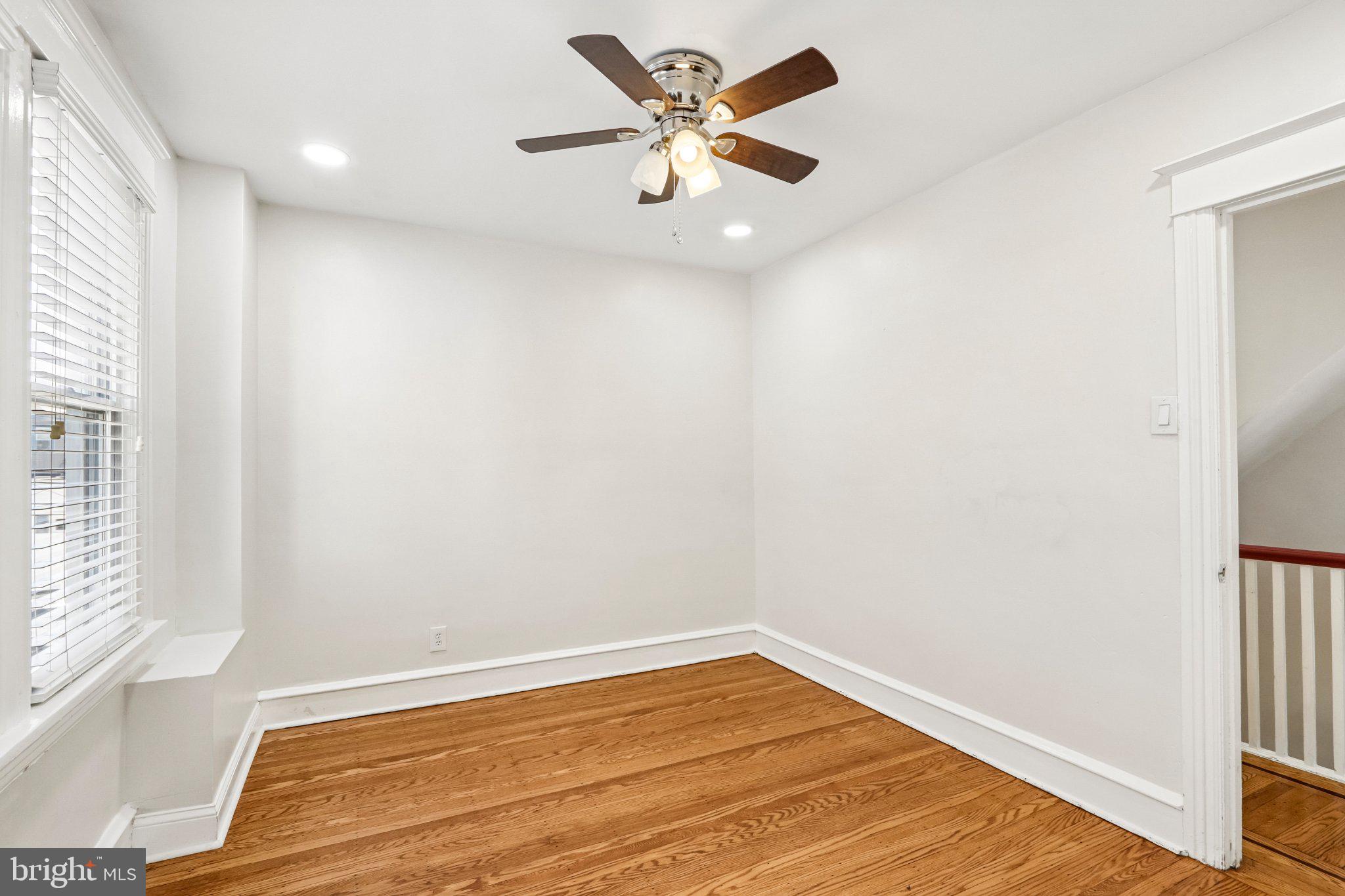 7407 Rogers Avenue Upper Darby, PA 19082 - Photo 27 of 50 wooden floor in an empty room with a window