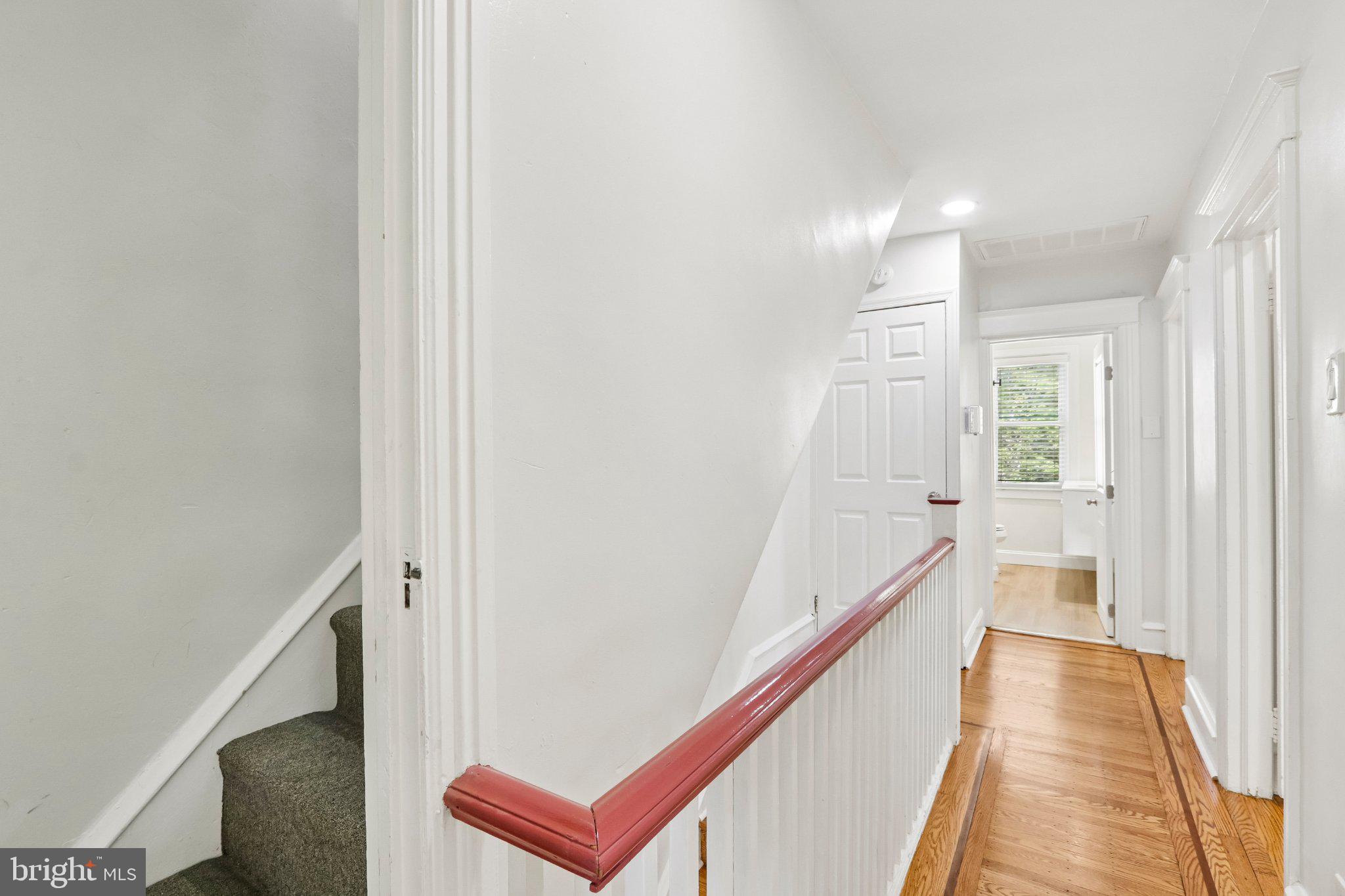 7407 Rogers Avenue Upper Darby, PA 19082 - Photo 31 of 50 a view of a hallway with wooden floor and staircase