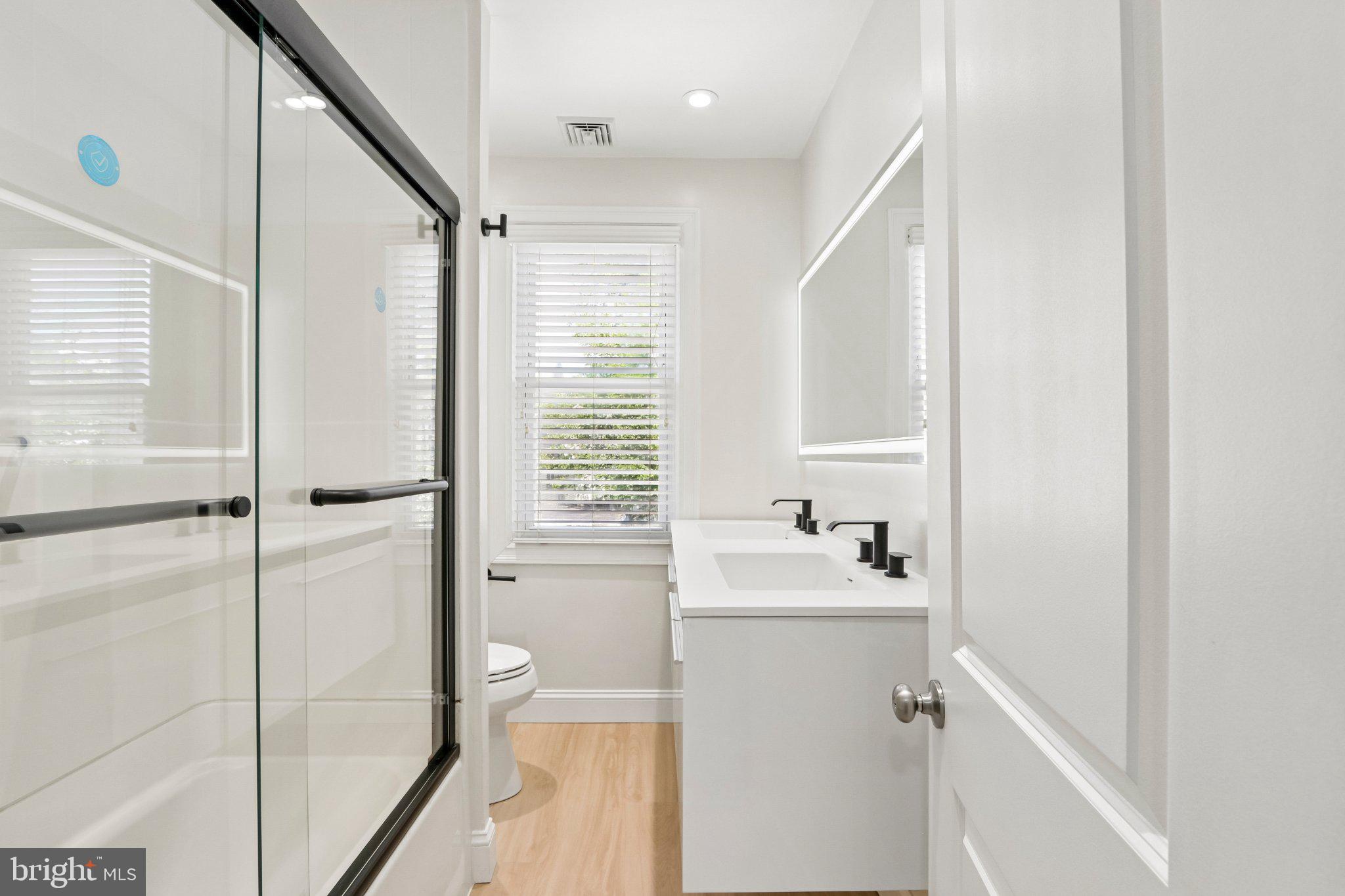 7407 Rogers Avenue Upper Darby, PA 19082 - Photo 33 of 50 a bathroom with a sink a tub and a mirror