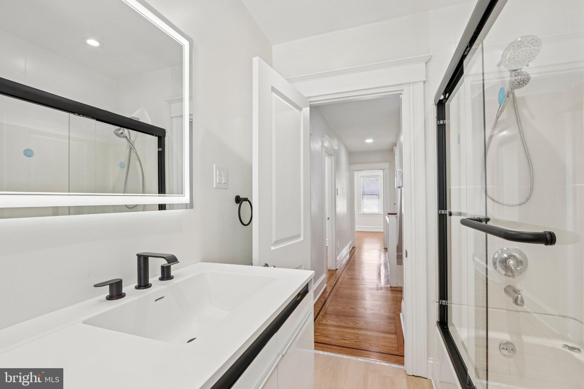 7407 Rogers Avenue Upper Darby, PA 19082 - Photo 34 of 50 a bathroom with a sink and a mirror