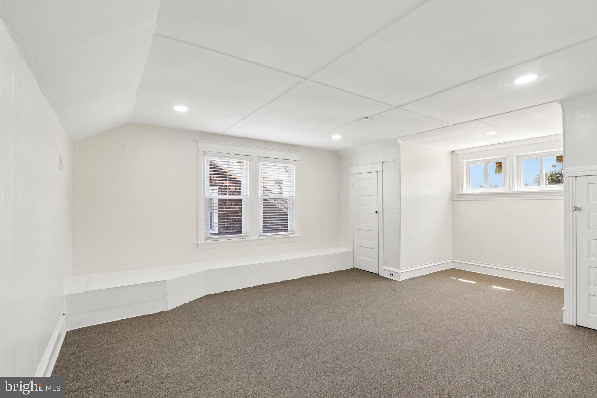 7407 Rogers Avenue Upper Darby, PA 19082 - Photo 35 of 50 an empty room with a empty space and windows