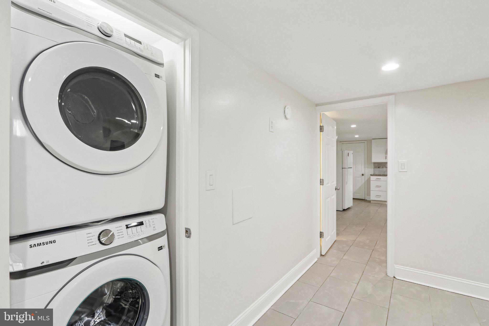 7407 Rogers Avenue Upper Darby, PA 19082 - Photo 43 of 50 a view of a hallway with washer and dryer
