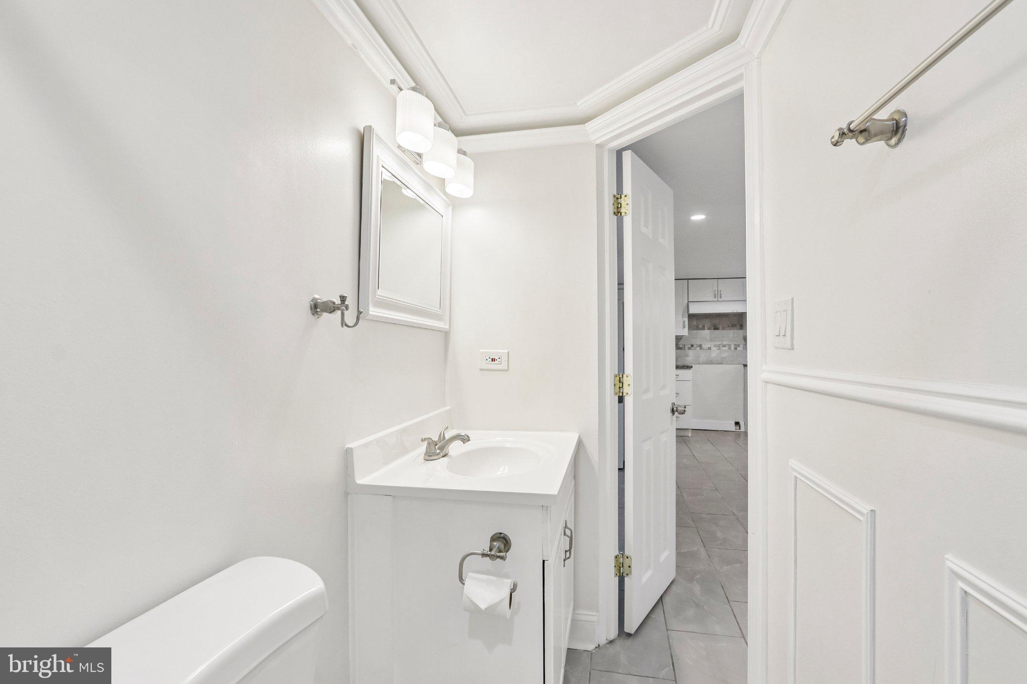 7407 Rogers Avenue Upper Darby, PA 19082 - Photo 45 of 50 a bathroom with a sink a toilet and shower