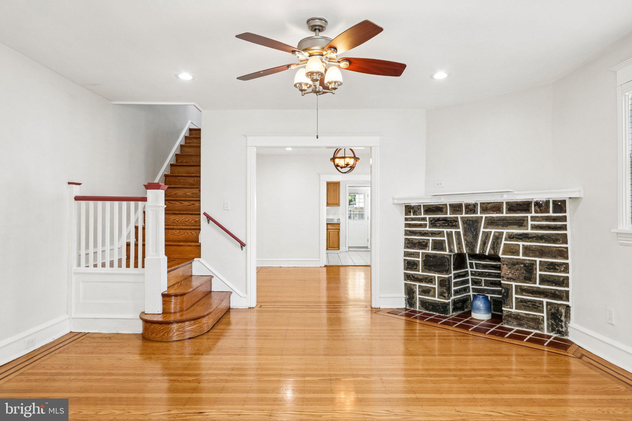 7407 Rogers Avenue Upper Darby, PA 19082 - Photo 8 of 50 a view of an empty room with a window and a ceiling fan