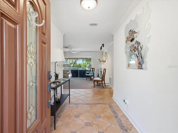 a view of a dining room with furniture wooden floor and chandelier