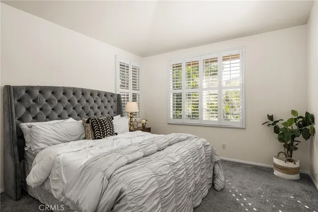 a bathroom with a sink toilet a mirror and shower