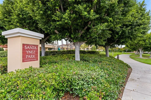 a swimming pool with outdoor seating and yard