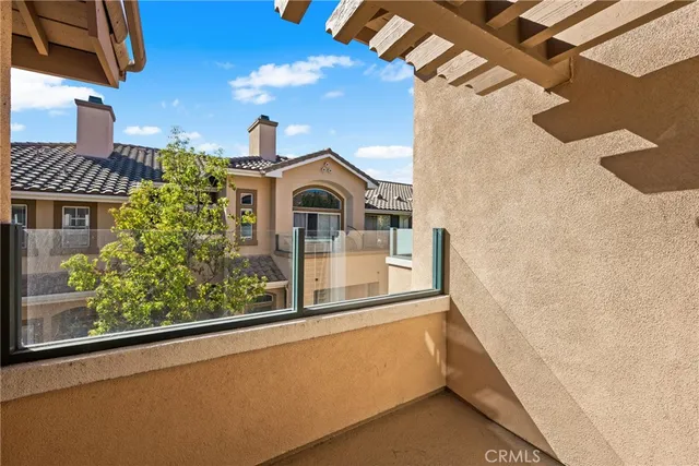 a living room with furniture a fireplace and a large window