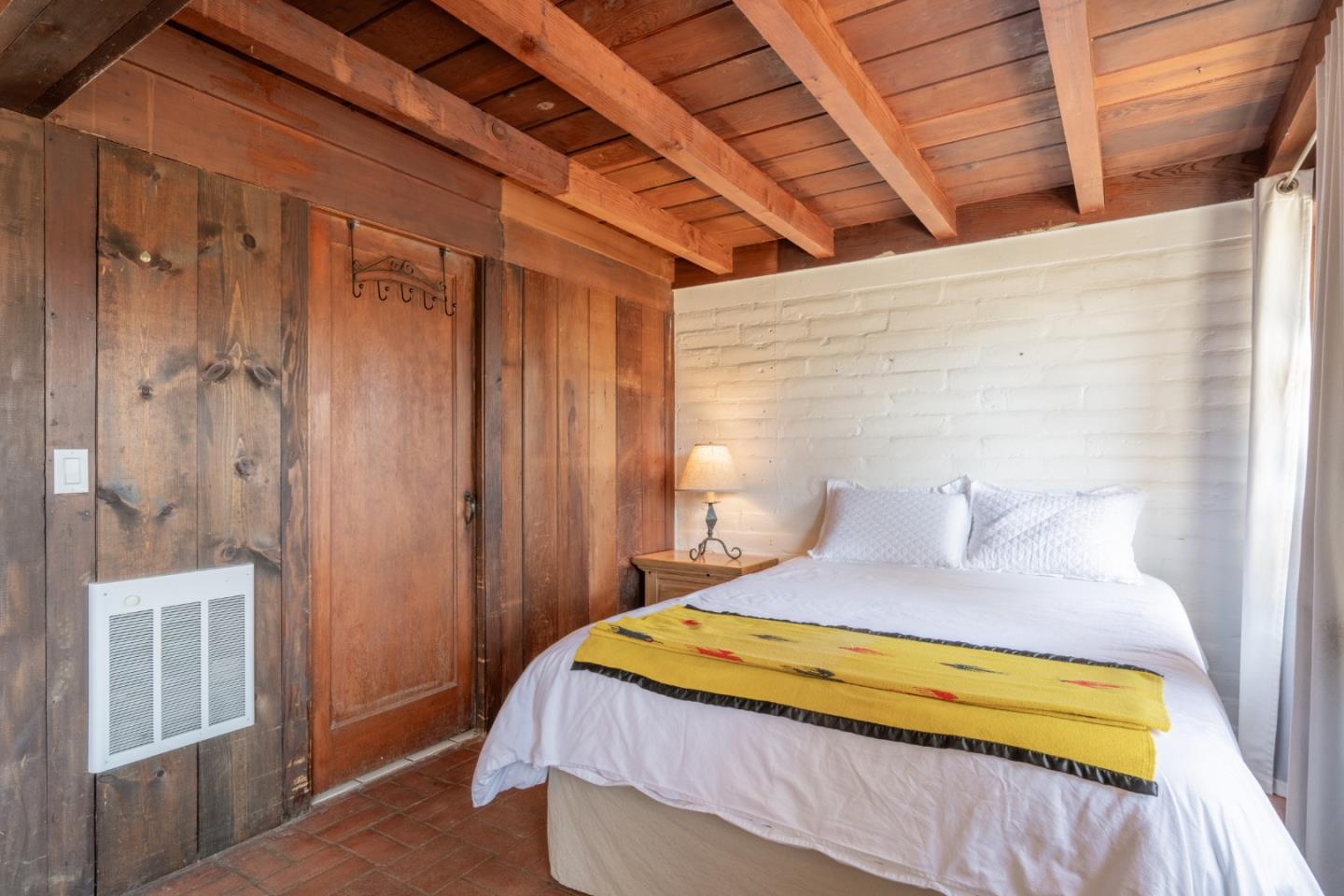 72 Los Laureles Grade Road Carmel Valley, CA 93924 - Photo 37 of 43 a bedroom with a bed and a window