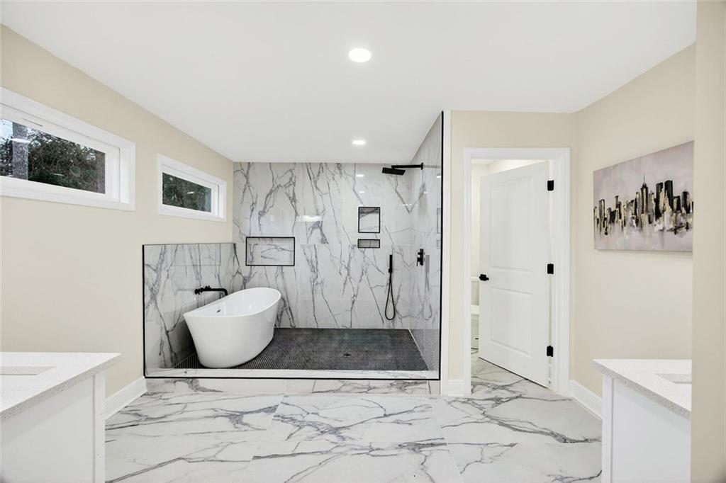 3365 Ardley Road Southwest Atlanta, GA 30311 - Photo 15 of 34 a bathroom with a bathtub and a shower