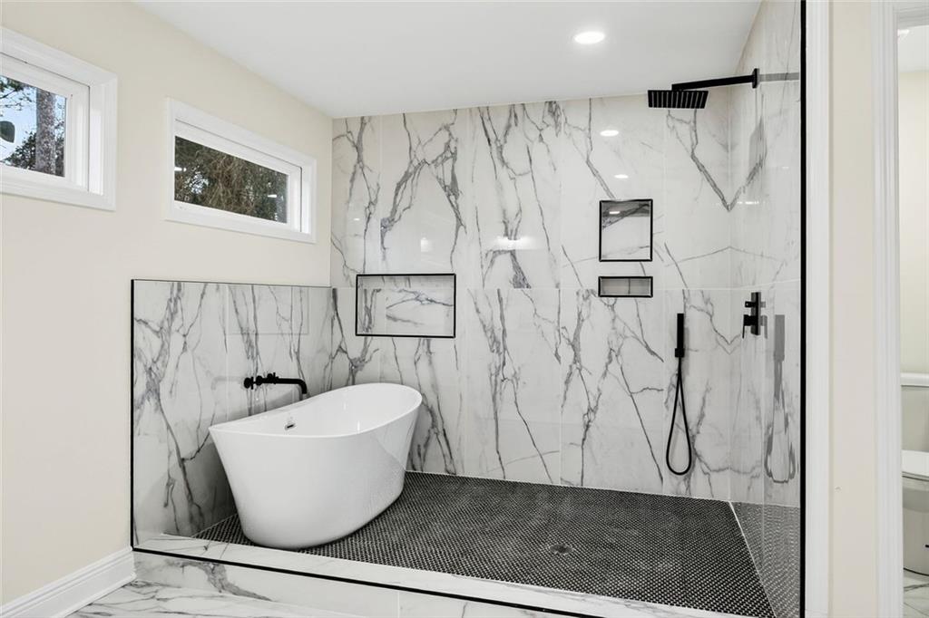 3365 Ardley Road Southwest Atlanta, GA 30311 - Photo 16 of 34 a bathroom with a bathtub and shower