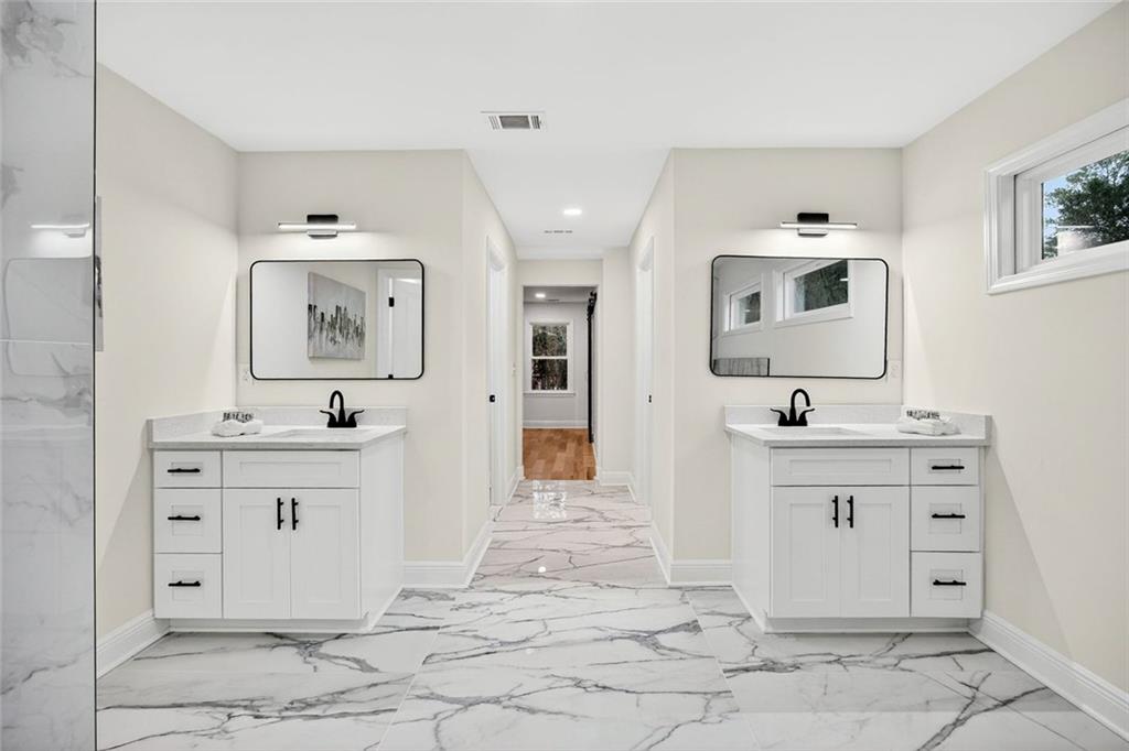3365 Ardley Road Southwest Atlanta, GA 30311 - Photo 17 of 34 a bathroom with a sink vanity and mirror