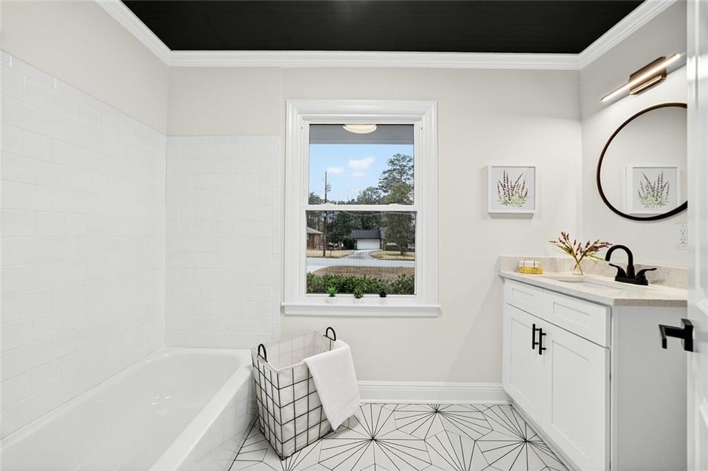 3365 Ardley Road Southwest Atlanta, GA 30311 - Photo 20 of 34 a bathroom with a bathtub and a sink