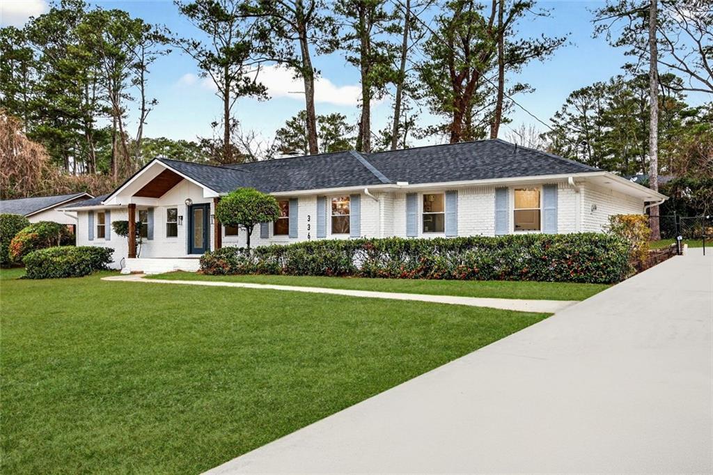 3365 Ardley Road Southwest Atlanta, GA 30311 - Photo 2 of 34 a front view of a house with a garden