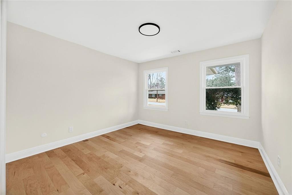 3365 Ardley Road Southwest Atlanta, GA 30311 - Photo 22 of 34 an empty room with windows