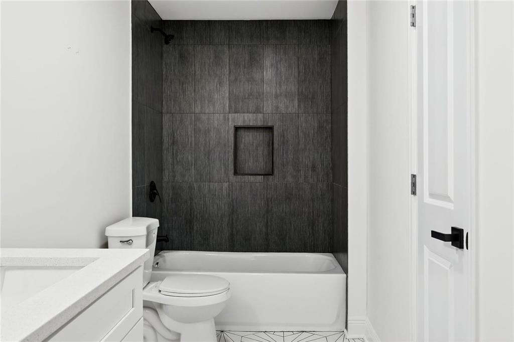 3365 Ardley Road Southwest Atlanta, GA 30311 - Photo 25 of 34 a bathroom with a toilet and a shower