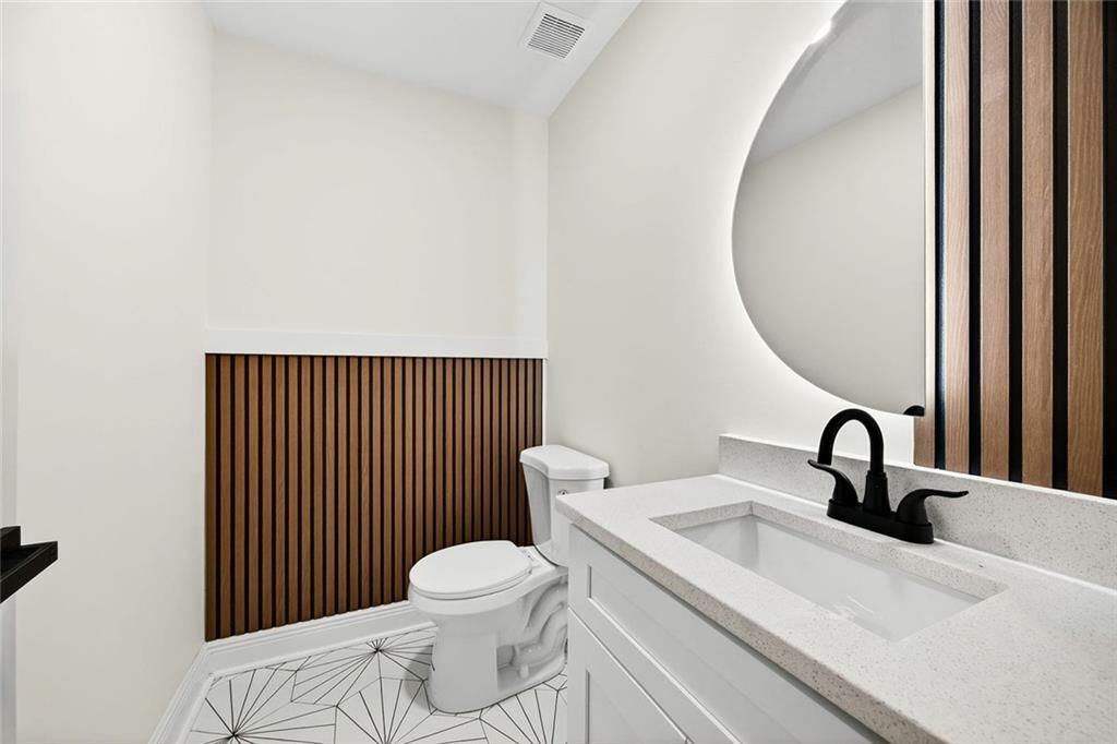3365 Ardley Road Southwest Atlanta, GA 30311 - Photo 27 of 34 a bathroom with a sink and a mirror