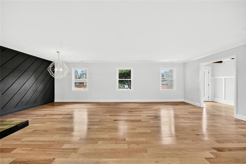3365 Ardley Road Southwest Atlanta, GA 30311 - Photo 28 of 34 a view of an empty room with wooden floor and a window