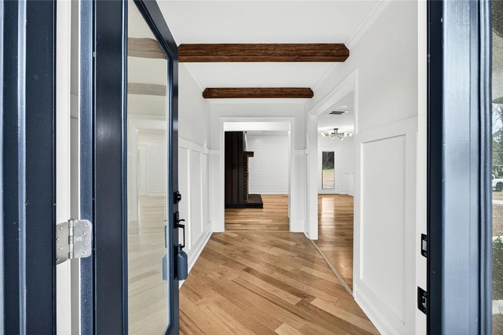 3365 Ardley Road Southwest Atlanta, GA 30311 - Photo 30 of 34 a view of a hallway with wooden floor and staircase
