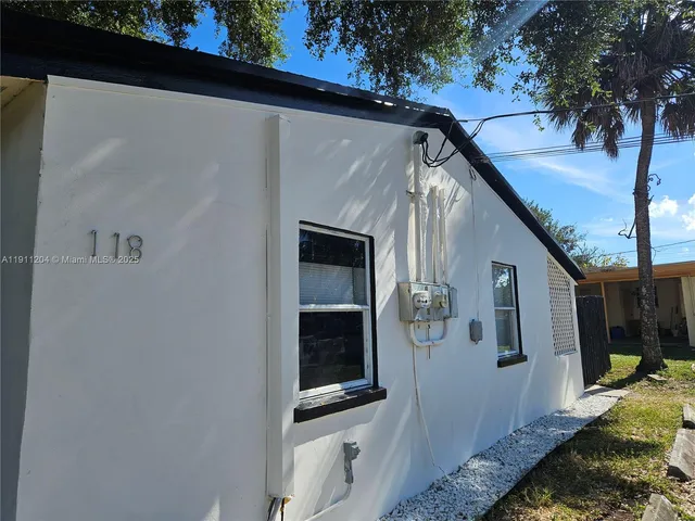 a backyard of a house with seating space