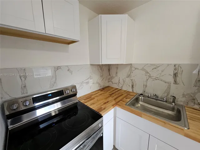a view of a stove with kitchen island