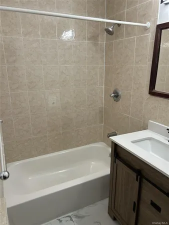 a bathroom with a sink and a bathtub