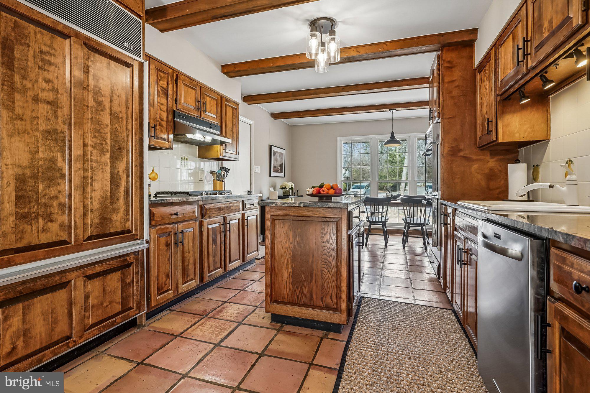 2502 Woodcutter Court Reston, VA 20191 - Photo 15 of 73 a kitchen with stainless steel appliances granite countertop a stove a sink and a refrigerator