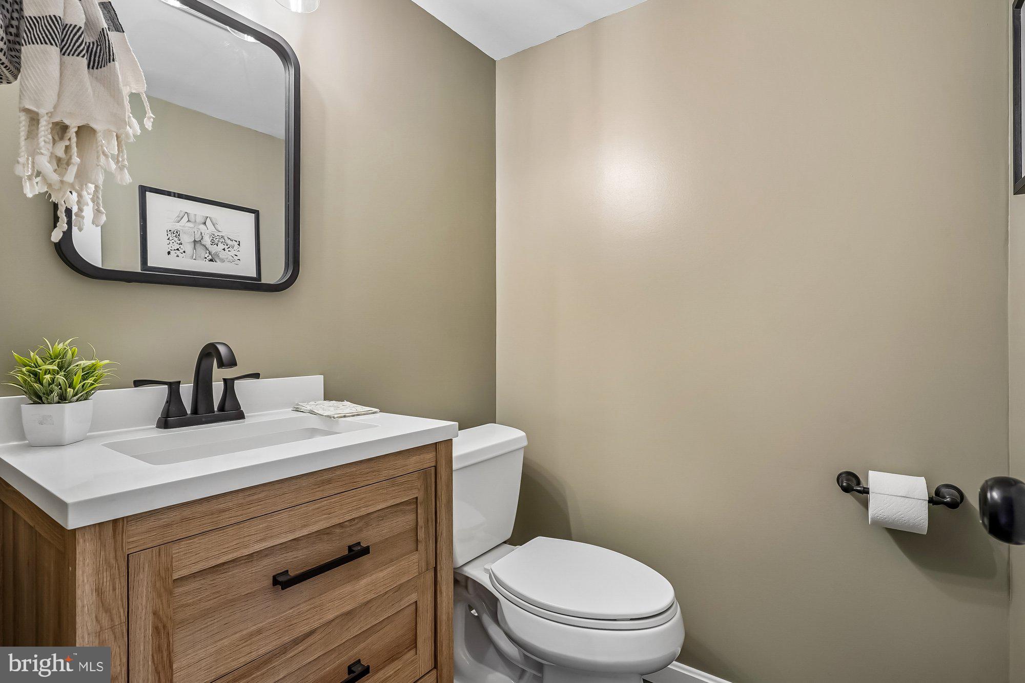 2502 Woodcutter Court Reston, VA 20191 - Photo 43 of 73 a bathroom with a granite countertop toilet sink and mirror