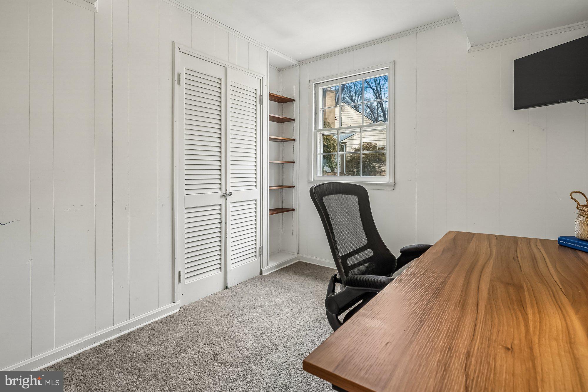 2502 Woodcutter Court Reston, VA 20191 - Photo 45 of 73 a view of a workspace with furniture and a window