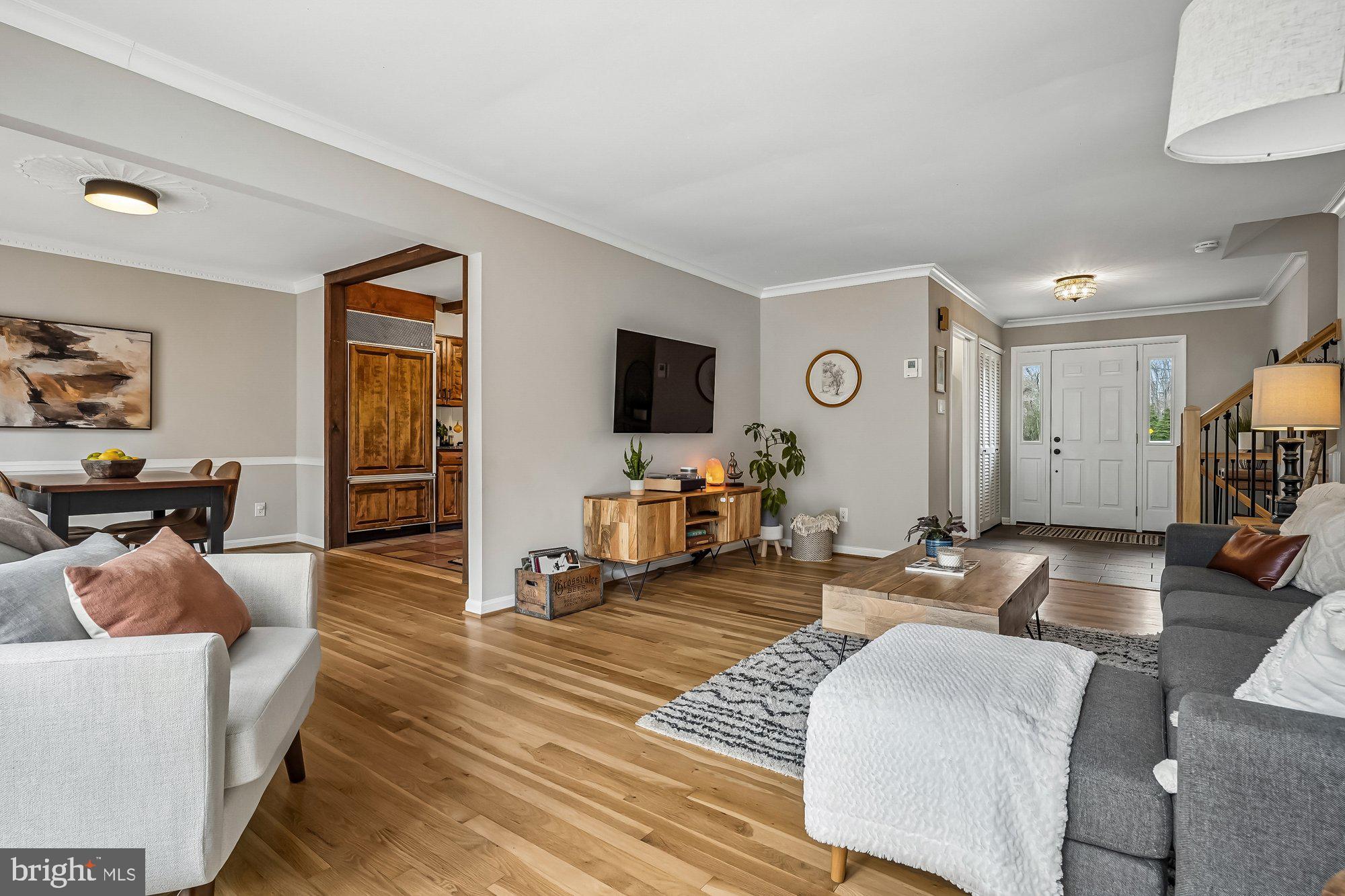 2502 Woodcutter Court Reston, VA 20191 - Photo 7 of 73 a living room with furniture and a flat screen tv