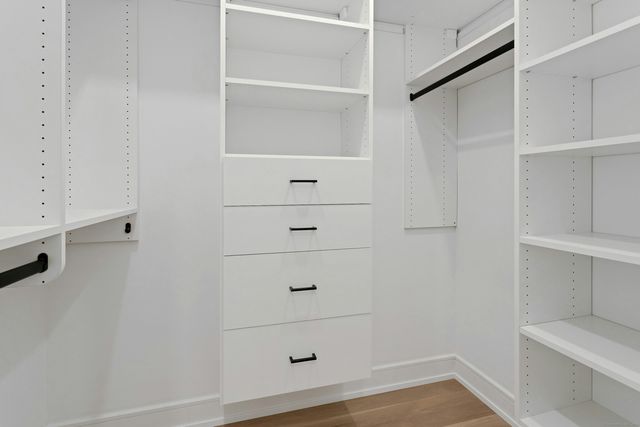 a view of an empty walk in closet
