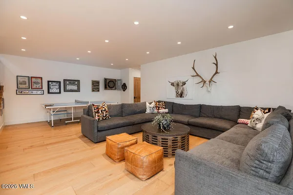 a bedroom with furniture and a large window