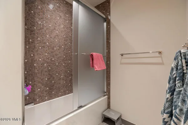 a bedroom with a bed and a table in it