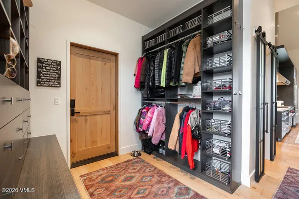 a kitchen with stainless steel appliances granite countertop a sink and a refrigerator