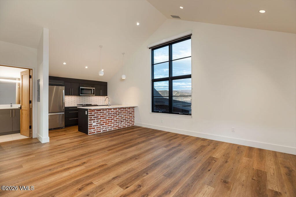 99 Silver Spur Eagle, CO 81631 - Photo 32 of 40 a view of kitchen with stainless steel appliances kitchen island wooden floor and window
