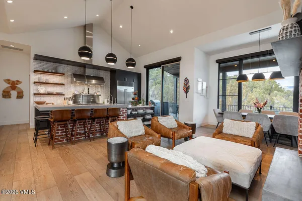 a living room with fireplace furniture and a flat screen tv