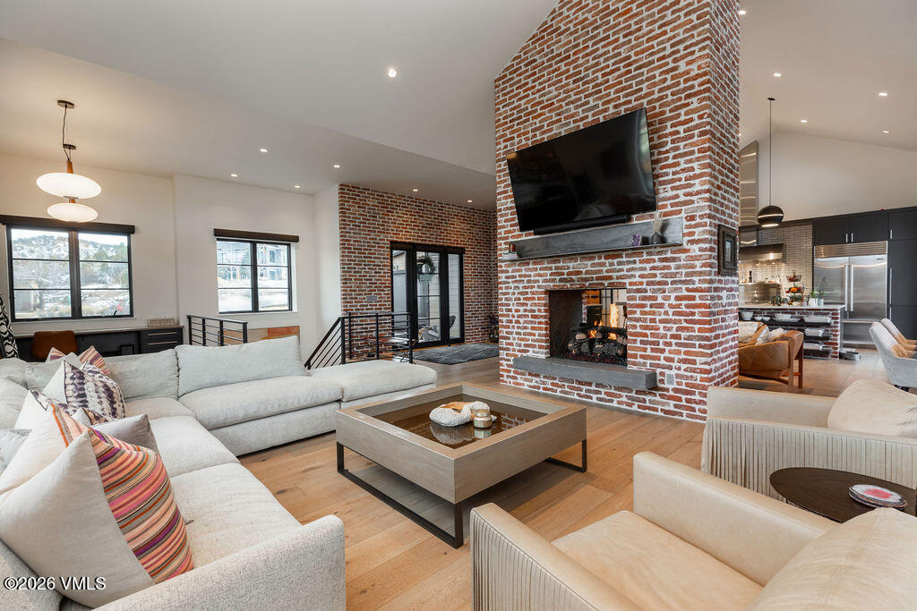 99 Silver Spur Eagle, CO 81631 - Photo 8 of 40 a living room with fireplace furniture and a flat screen tv