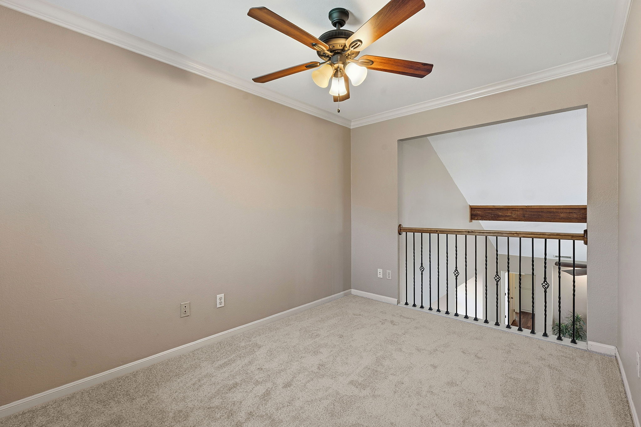 4601 Creek Ridge Austin, TX 78735 - Photo 14 of 40 Carpeted empty room featuring a ceiling fan and ornamental molding