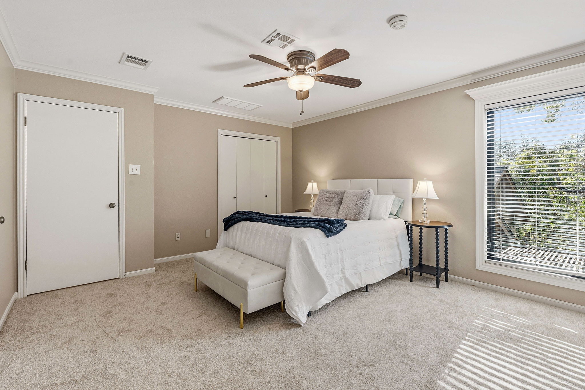 4601 Creek Ridge Austin, TX 78735 - Photo 17 of 40 Bedroom with crown molding, light carpet, ceiling fan, and a closet