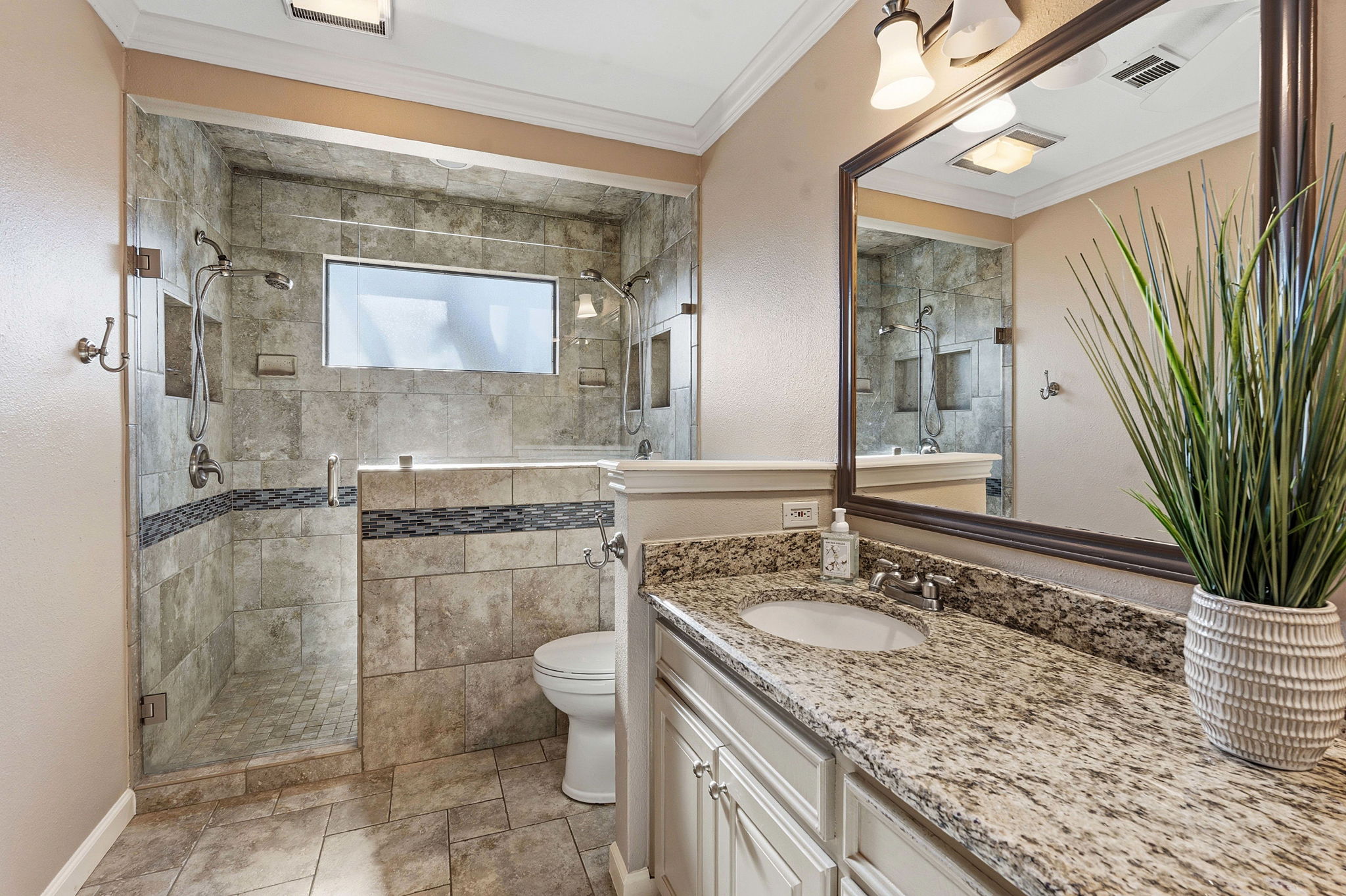 4601 Creek Ridge Austin, TX 78735 - Photo 19 of 40 Bathroom with crown molding, vanity, and a stall shower