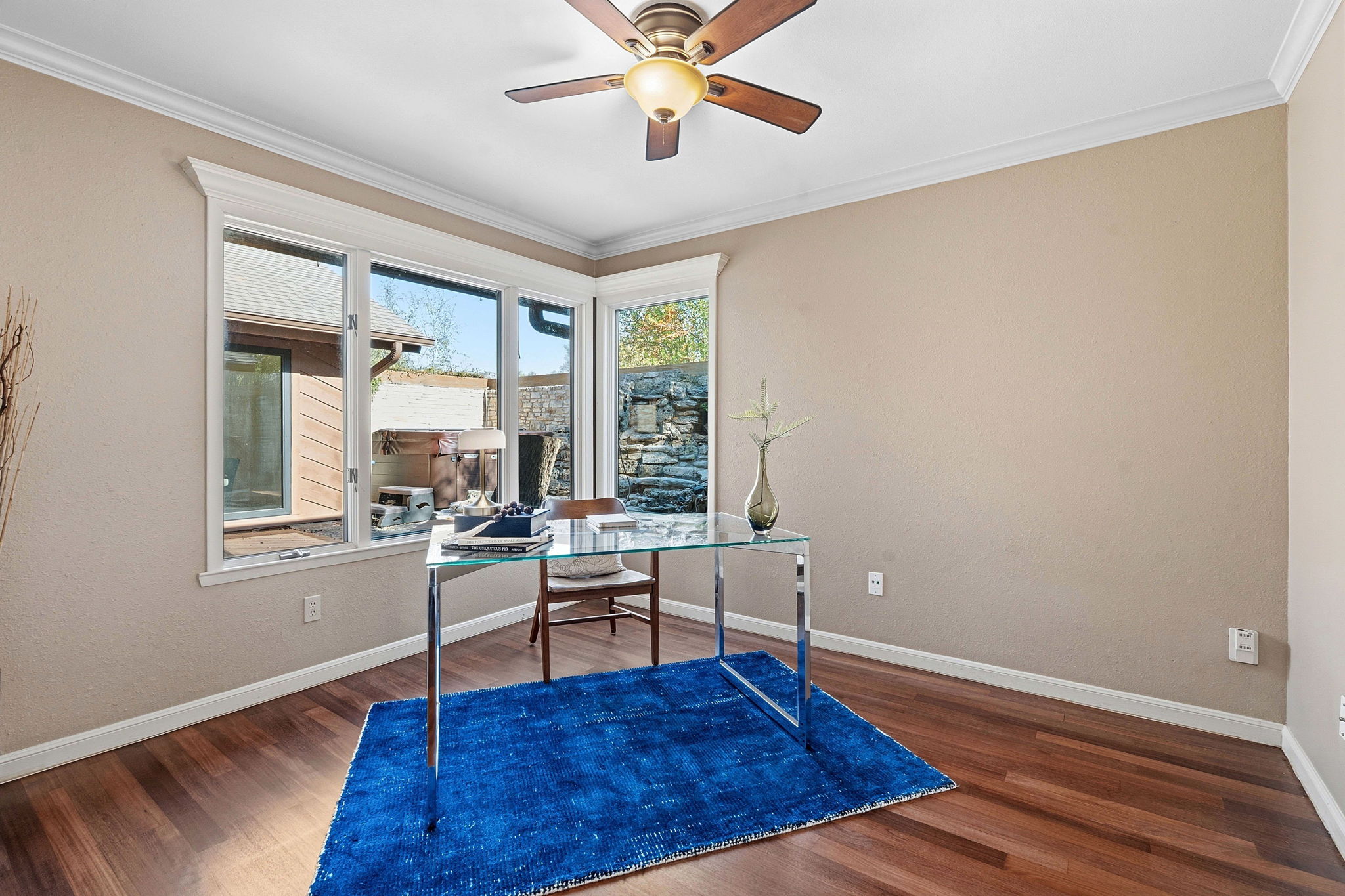 4601 Creek Ridge Austin, TX 78735 - Photo 20 of 40 Home office with dark wood-type flooring, ornamental molding, and ceiling fan